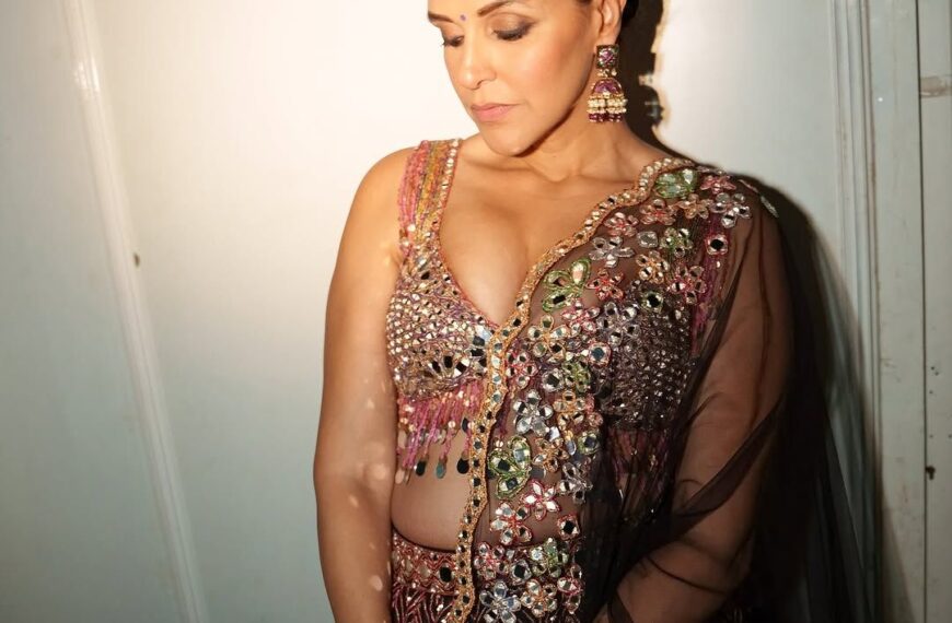 Neha Dhupia combines mirror-work with a sleek bun in her Abhinav Mishra ensemble