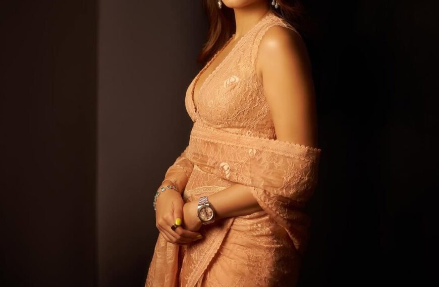 Mira Kapoor wears a peachy pink sari that spotlights delicate lace and intricate embroidery