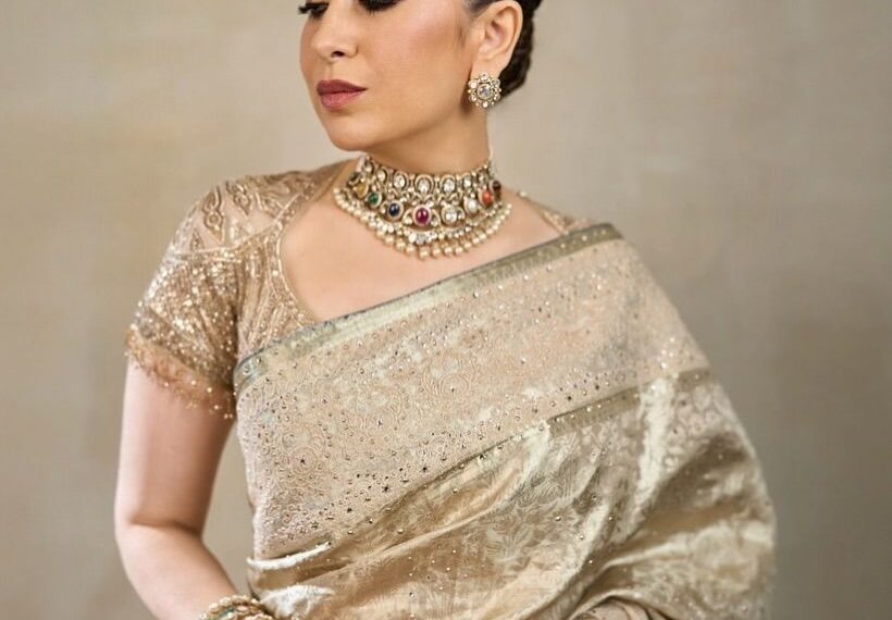 Karisma Kapoor’s champagne Kanjeevaram sari by Tarun Tahiliani was accented with Chantilly lace
