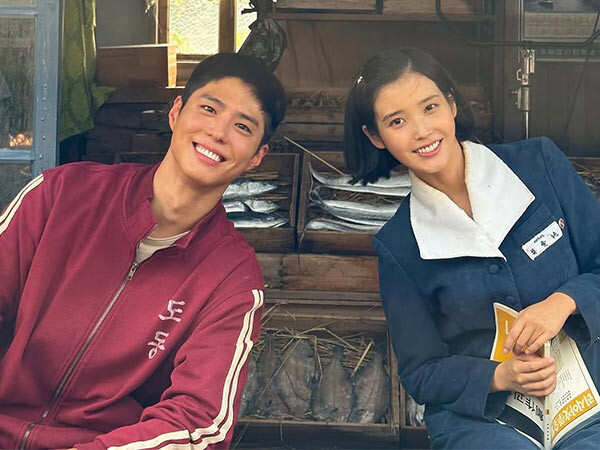 IU Drops BTS Photos From When Life Gives You Tangerines With Park Bo Gum