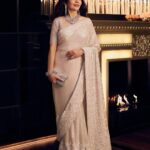 Nita Ambani’s off-white sari builds its impact through resham work, crystals and sequins
