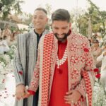 At this beach wedding in Thailand, the grooms arrived with a joint baraat and exchanged mangalsutra bracelets