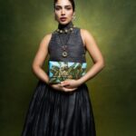 Bhumi Pednekkar offsets a darker palette with a painted tiger bag and ornate jewellery