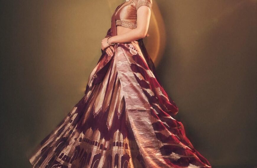 Sreeleela’s wine organza silk lehenga features zari motifs inspired by palatial architecture