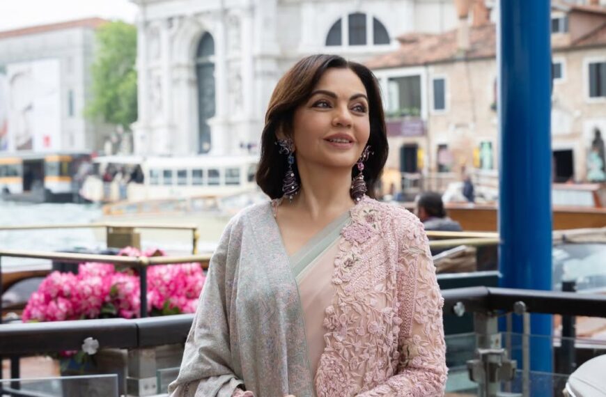 Nita Ambani’s ensemble pairs an Anamika Khanna ombré chiffon-georgette sari with a Swadesh Sozni shawl