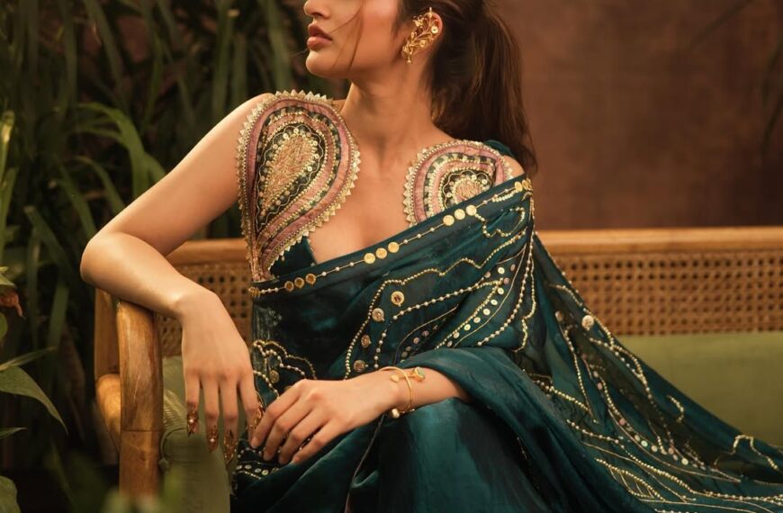 Sreeleela’s emerald-green sari comes with pearl embellishments and gold sequins